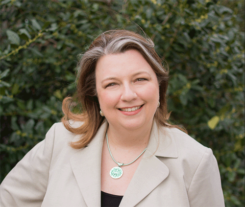A person (Julie Uranis) smiling