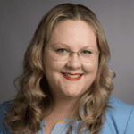 A person (Carmin Chan) smiling