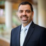 A person (Charles Iacovou) smiling