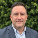 A person (James DeVaney) smiling