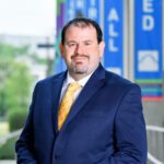 A person (Luke Dowden) smiling