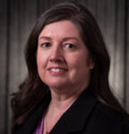 A person (Michele Gribbins) smiling