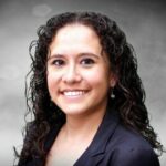 A person (Michelle Singh) smiling