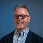 A person (Ryan Anderson) smiling