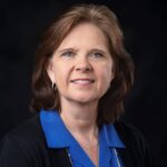 A person (Susan Seal) smiling