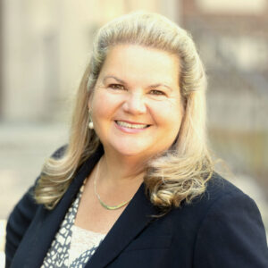 A person (Nancy Coleman) smiling