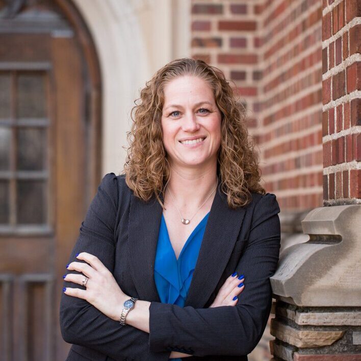 A person (Andrea Gross) smiling