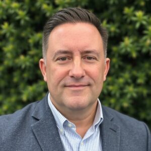 A person (James DeVaney) smiling