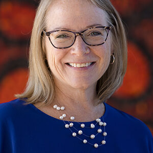 A person (Julia Denholm) smiling