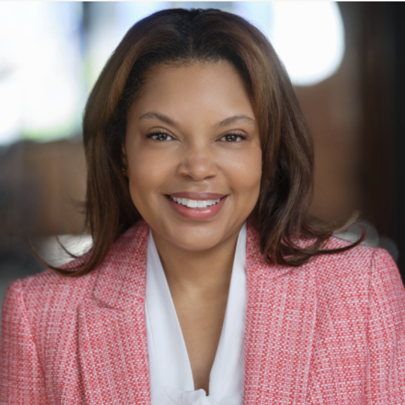 A person (Tatum Thomas) smiling