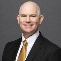 A person (Tom Cavanagh) smiling