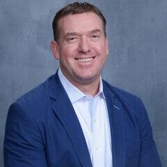 A person (Eric McGee) smiling