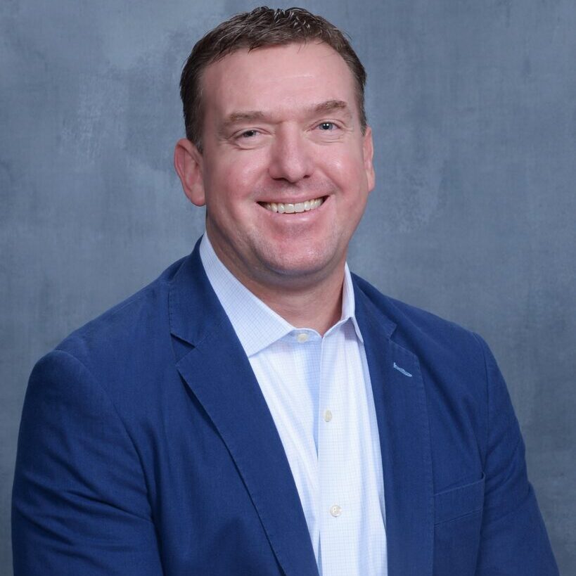 A person (Eric McGee) smiling